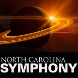 The planet Saturn, with the light of the sun peering behind from around the rings.