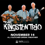 Photo of The Kingston Trio wearing a blue strip shirt and playing the guitar 
