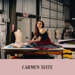 Photo of female dancer in costume sitting on set shop table with text saying, "Carmen Suite"