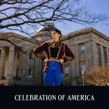 Photo of male dancer in uniform costume in front of NC Capitol building