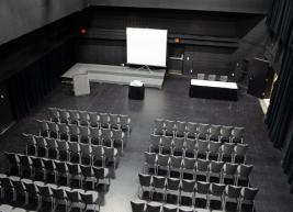 A view of Kennedy Theatre from above showing 2 multiple rows of chairs set up