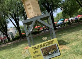 The Martin Marietta Center hive with a sign in front showing Powell Elementary class holding sign that says Queen Elizabuzz