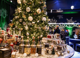 a photo of a christmas tree with dessert toppings around it