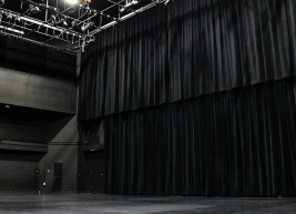 a photo of Kennedy Theatre a black curtain is shown