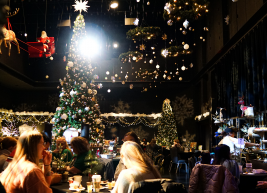 a photo of a room decorated with holiday decor