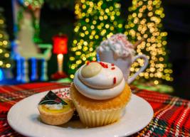 a photo of desserts on a plate with holiday decor in the background
