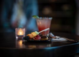 a photo of a drink and plate of food