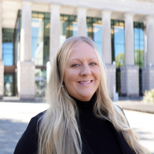 a photo of Shelly Westfall she has long blonde hair and is wearing a black shirt