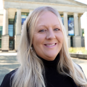 a photo of Shelly Westfall she has long blonde hair and is wearing a black shirt